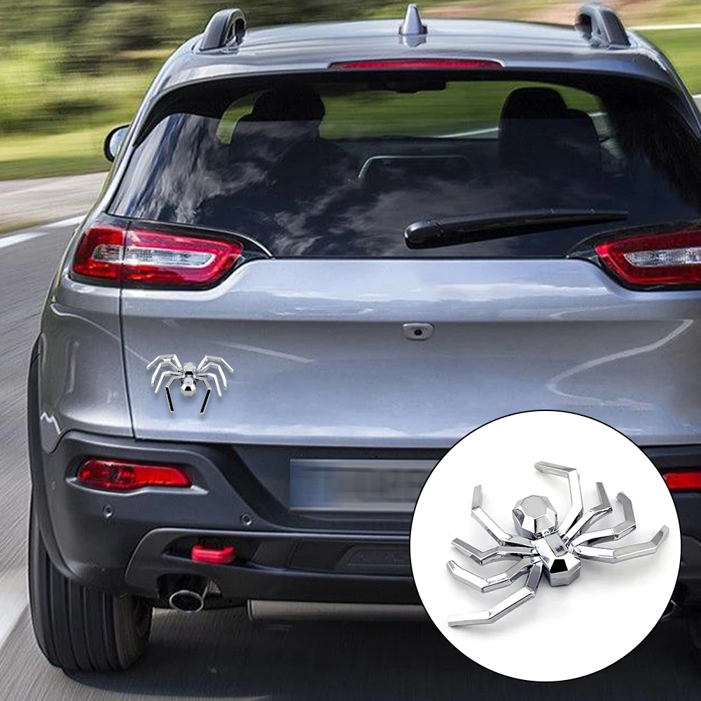 silver 3D spider emblem on vehicle bodywork