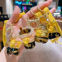 Netizens can reach duck keychains with oil floating cartoon figurine keychains, quicksand bottle pendants 1