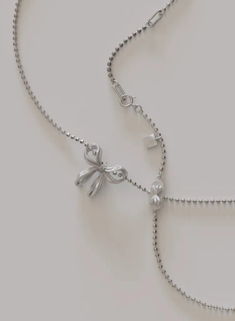 Silver Cylinder-shaped Beaded Chain with Butterfly Bowkont Charm Pendant