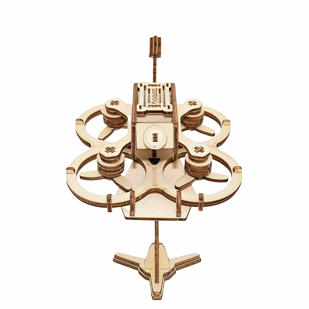 Drone FPV en bois 3D puzzle terminé, posé sur une surface