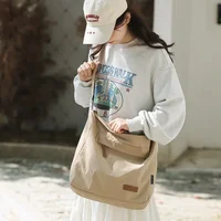 Sac à bandoulière japonais pour femmes et hommes, grands sacs messager en toile pour étudiants, sacs de livres de marque, sacoches à main féminines, 2024 2