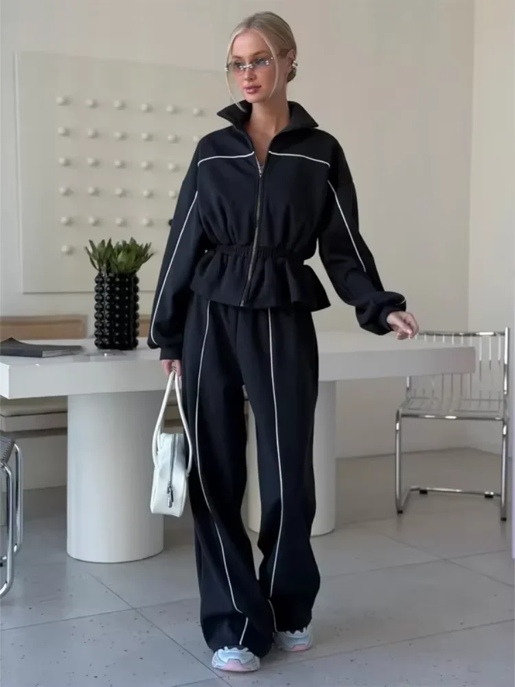 Ensemble de survêtement noir tendance pour femme, deux pièces, veste zippée à taille cintrée et pantalon à jambes larges, collection automne 2026, ensemble assorti pour femme. 1 Ensemble de survêtement noir tendance pour femme, deux pièces, veste zippée à taille cintrée et pantalon à jambes larges, collection automne 2026, ensemble assorti pour femme. 1