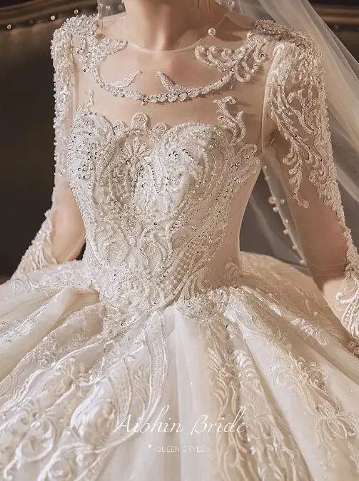 

New Illusion Wedding Dress O-Neck Long Sleeve Backless Pearl Sequined Appliques Lace Beading Ivory High-End Series Bridal Gowns