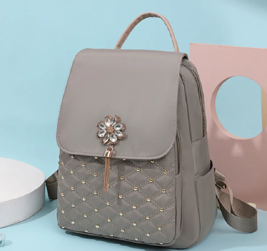 New Fashion Trend Waterproof Oxford Large Capacity Travel Shoulder Bags Laptop School Bag Handbag Women Rivet Tassel Backpack