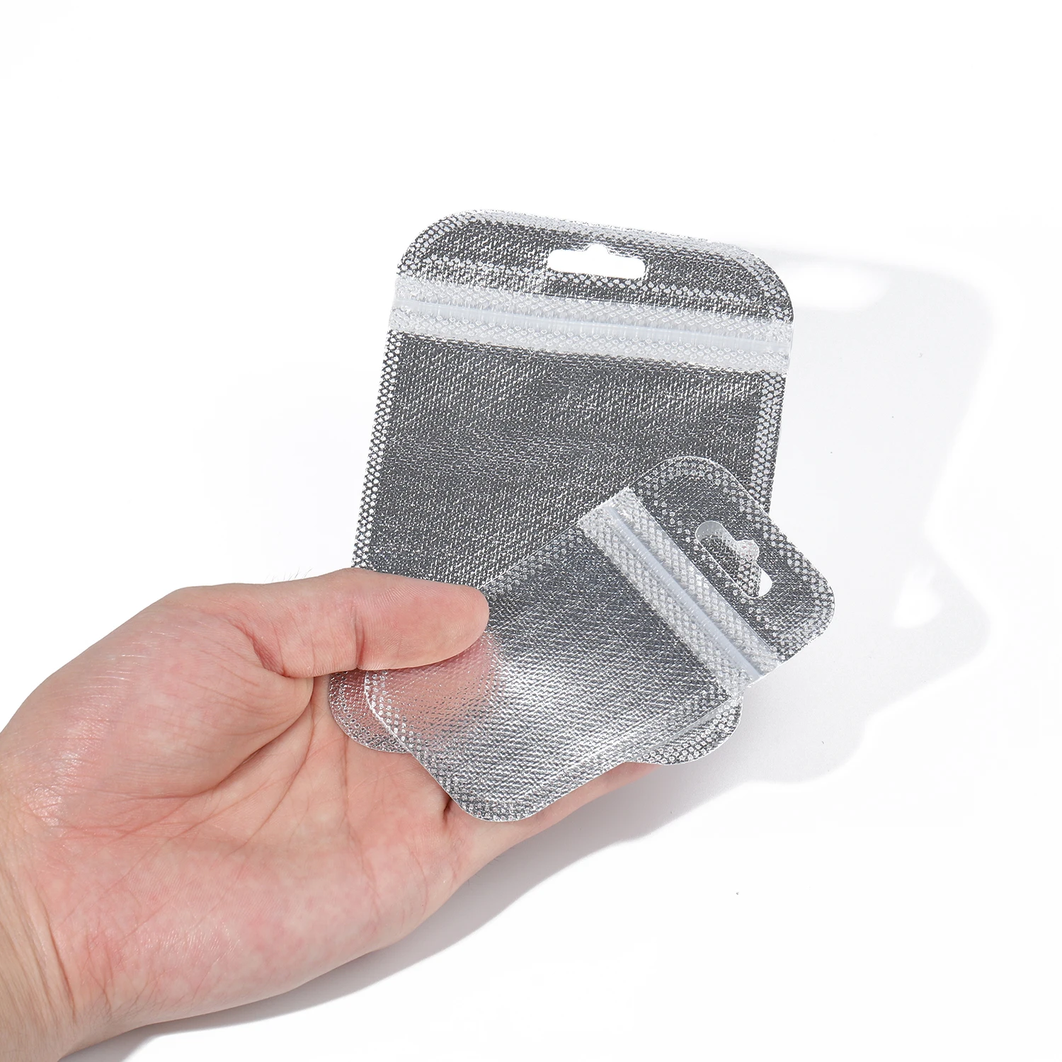 まとめ用 レザー・シリコン 25pc/bag Silver Ziplock Transparent Iridescent Bag Laser