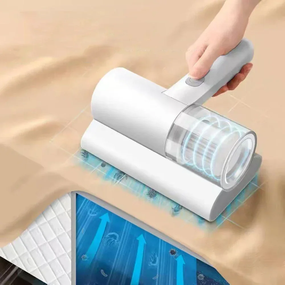 handheld white mattress vacuum cleaner placed on a bed