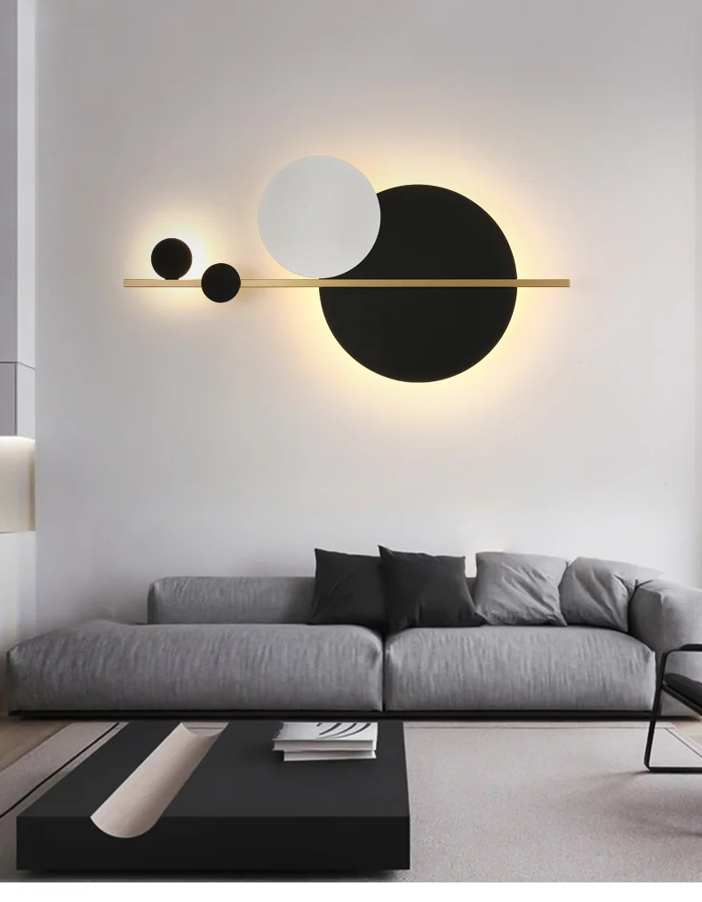 A minimalist living room featuring matte black circles on the wall, embodying Scandinavian design elements.