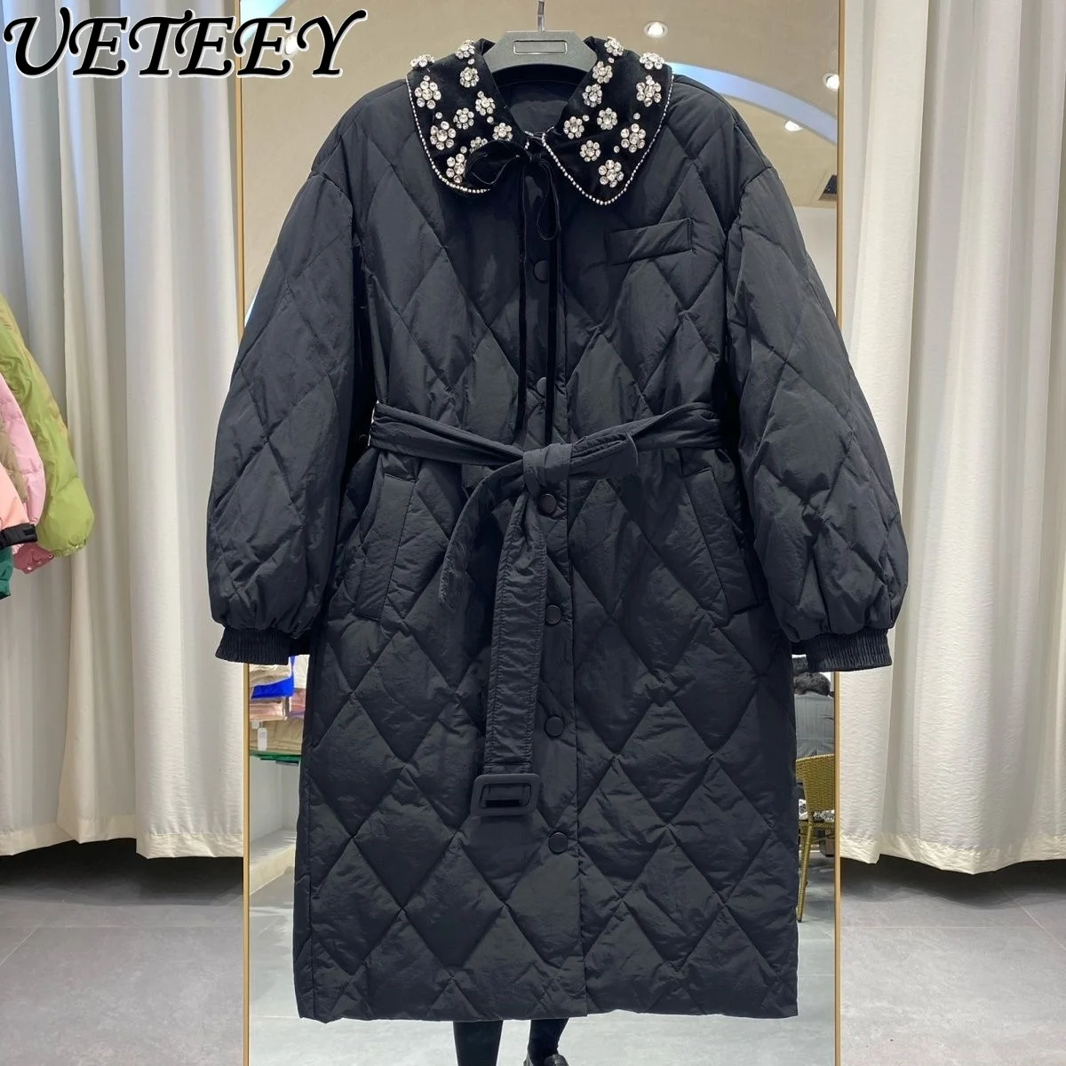 Рисунок 4 - Женский пуховик средней длины