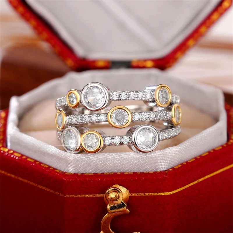 Huitan-anillos de dos tonos con personalidad para mujer, anillos de tres líneas, CZ pavimentado completo, bandas de boda femeninas brillantes, anillos de moda moderna, Nueva joyería