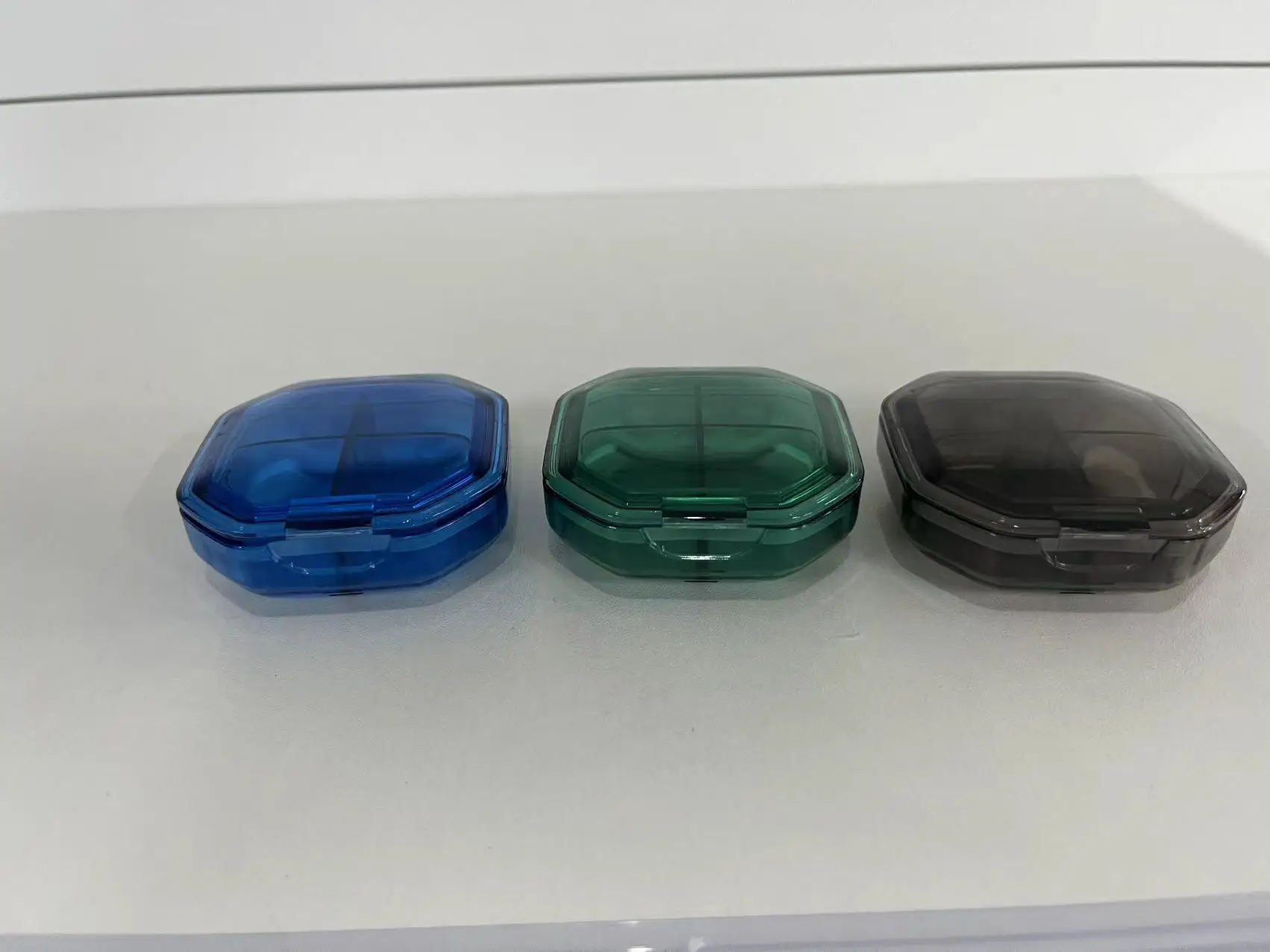 Multi color medicine box, portable for 7 days per week, with 21 compartments and 28 compartments for storage. Multi compartment