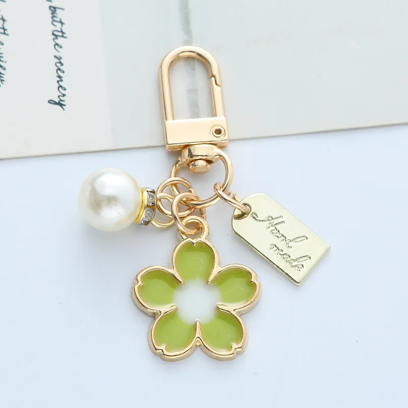 Süße Kirschblüten-Perlen-Schlüsselanhänger für Frauen und Mädchen, modisch, niedlich, goldfarben, Schlüsselschnalle, Kopfhörer-Box, Handtasche, Schlüssel, Dekoration, Geschenk