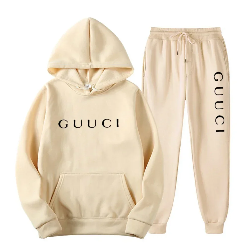 Man wearing autumn streetwear jogging set in urban outdoor setting dark beige