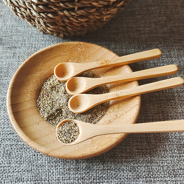 small wooden bowl with wooden baby spoon