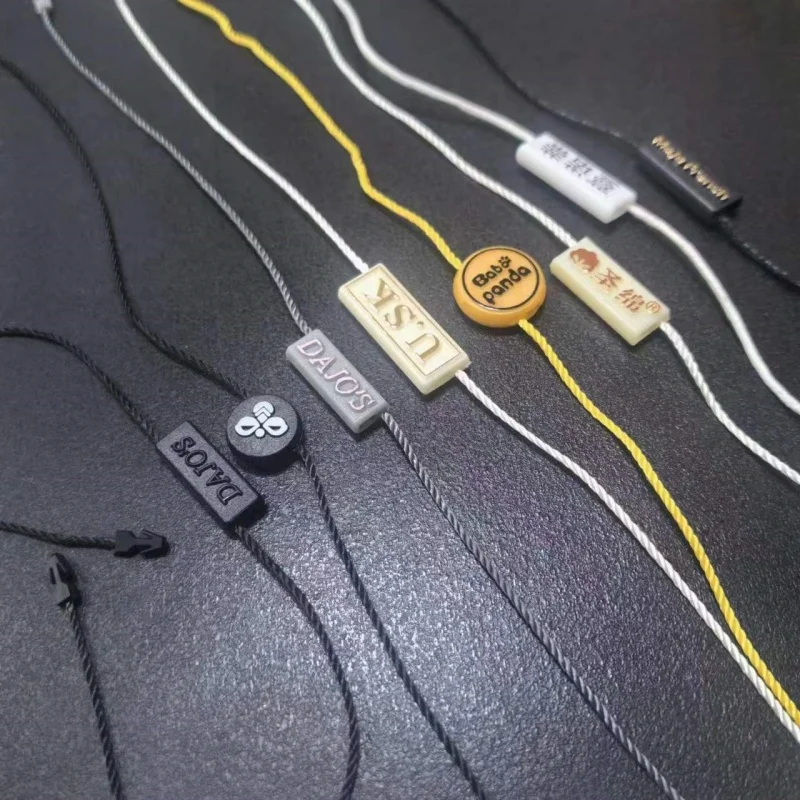 3D Embossed Brand Name Garment Hang Tag Rope Loops Plastic Seal Label Sustainable Hang Tag Rope Lock