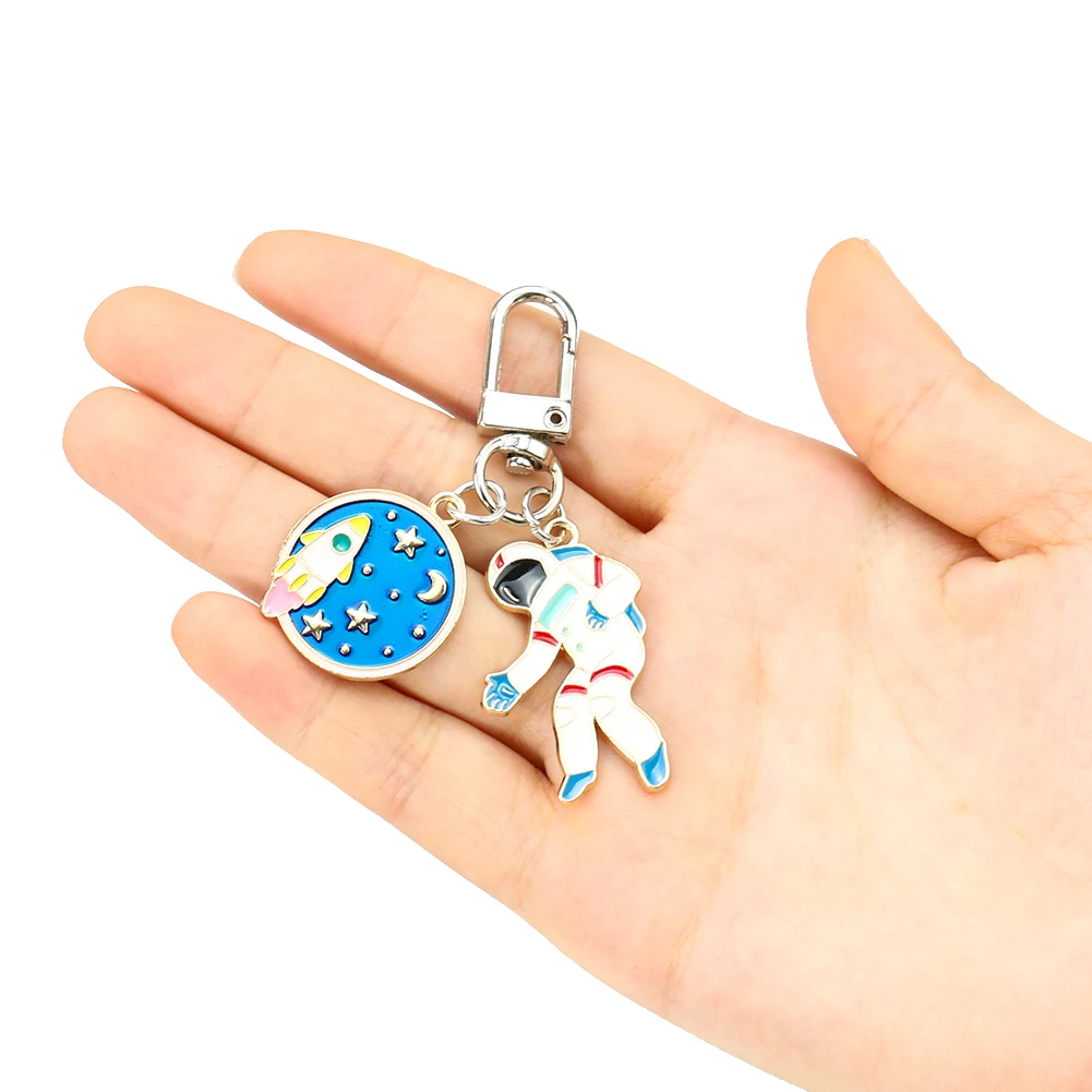 Raumfahrt-Astronauten-Schlüsselanhänger, Planeten-Universum, Raumfahrer, Flucht von der Erde, Raketen-Schlüsselhalter, Auto-Schlüsselring, Taschenanhänger, Geschenk