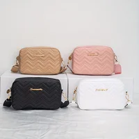 An embroidered wave patterned crossbody bag with wide shoulder straps and letter labels, a fashionable and simple casual small s