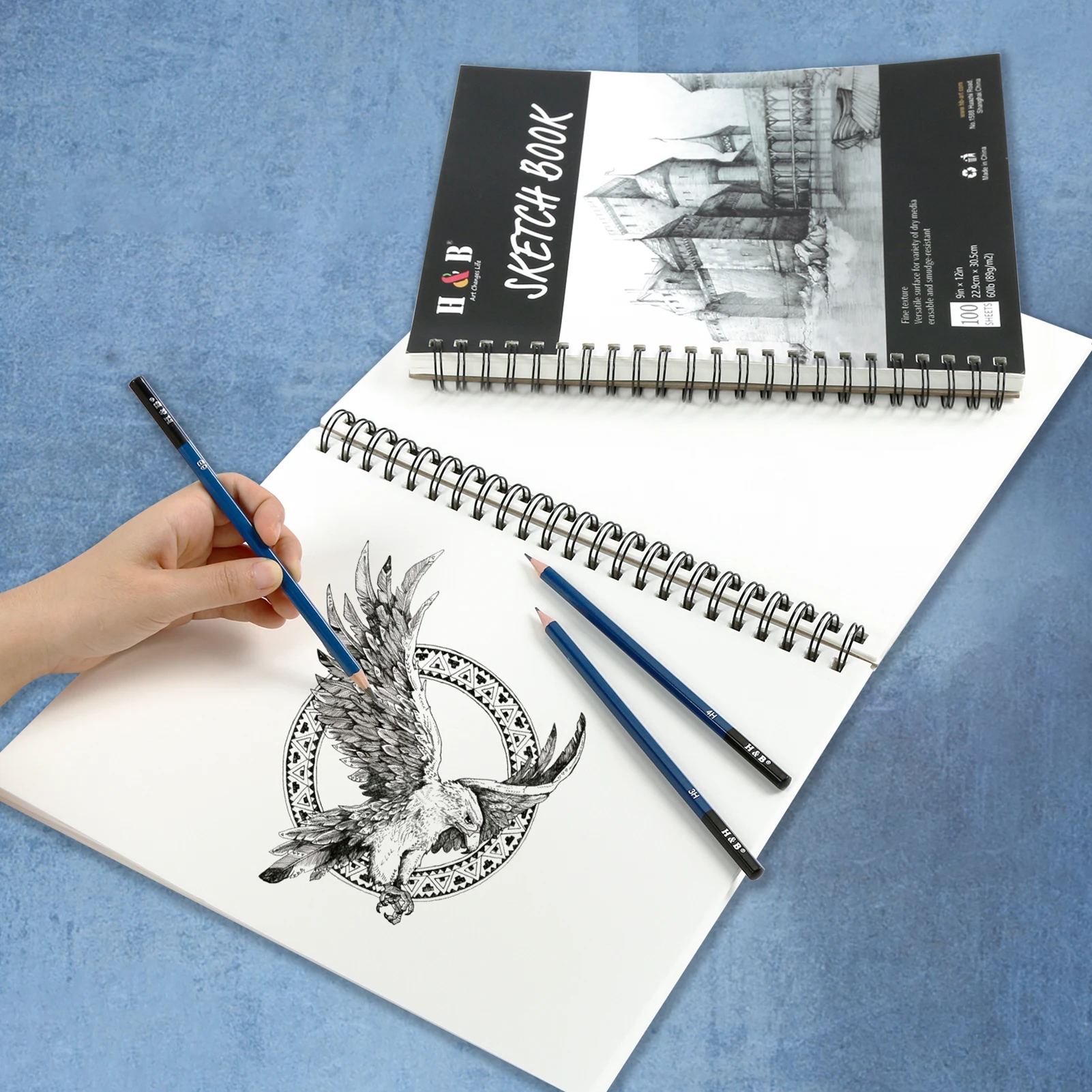 https://ae01.alicdn.com/kf/S20e48fc8a51a4bc1bc63897657e151571/H-B-9x12-Sketch-Book-Spiral-Bound-Artist-Sketch-Pad-Drawing-Paper-100-Sheets-Art-Supplies.jpg