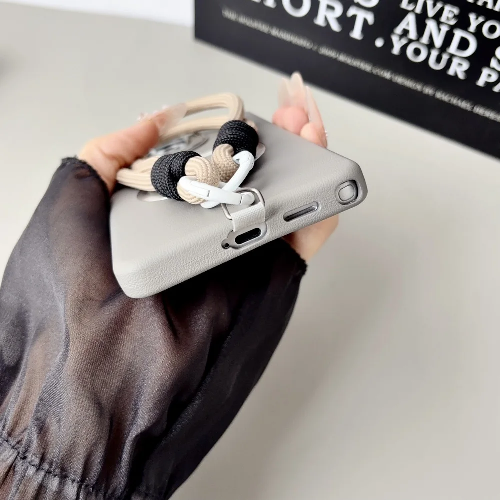 Leather Textured Wrist Strap Case with Metal Lens Bracket and Magnetic Ring Cover