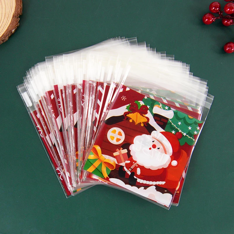 

100pcs Christmas Cookie Gift Bags Santa Claus Snowman Plastic Candy Biscuits Snack Packing Bag Christmas Party Favor Xmas Supply