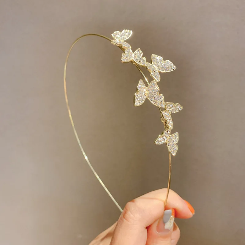 

Повязка на голову с бабочкой и золотым драгоценным камнем, роскошные обручи для волос из сплава с искусственными бриллиантами, новинка 2024, свадебные аксессуары для волос с кристаллами