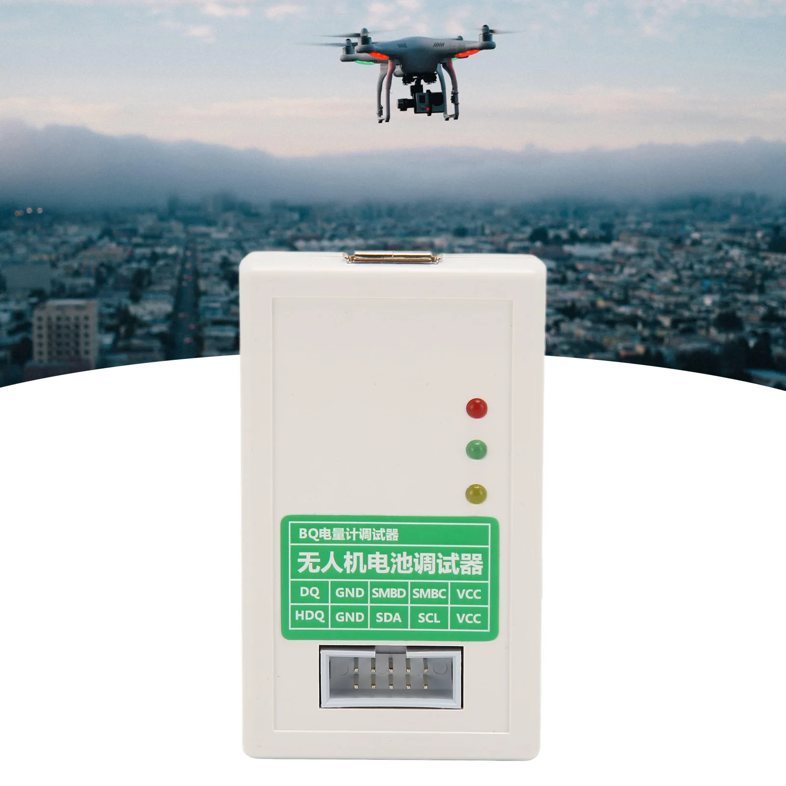 Programmeur EV2400 posé sur une table à côté d'une batterie DJI drone