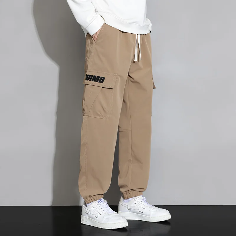 Spring Autumn New Solid Color Fashion Elastic Waist Cargo Trousers Man High Street Casual Pockets Drawstring Ankle Length Pants