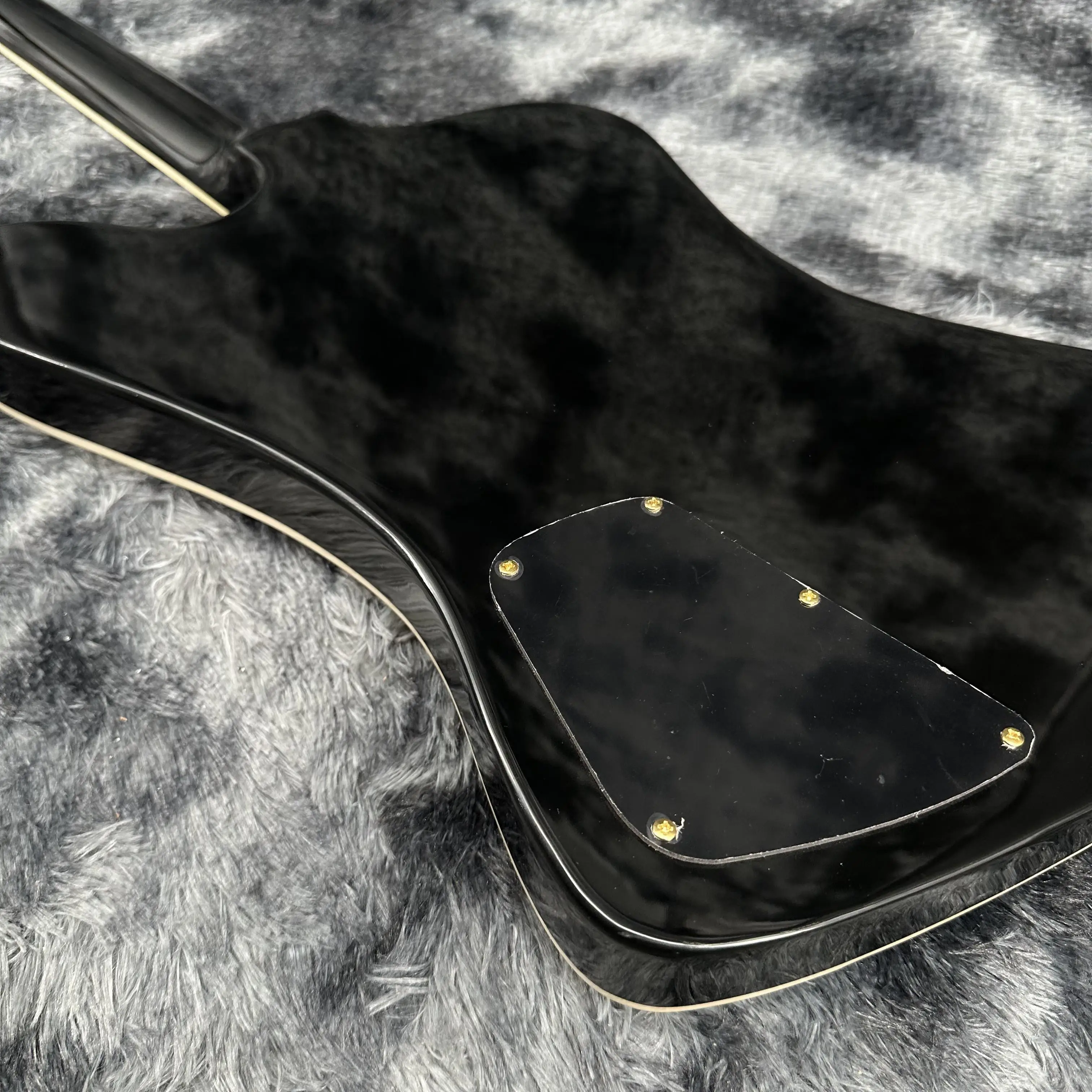 Firebird Black Electric Guitar with Electric Gold Accessories