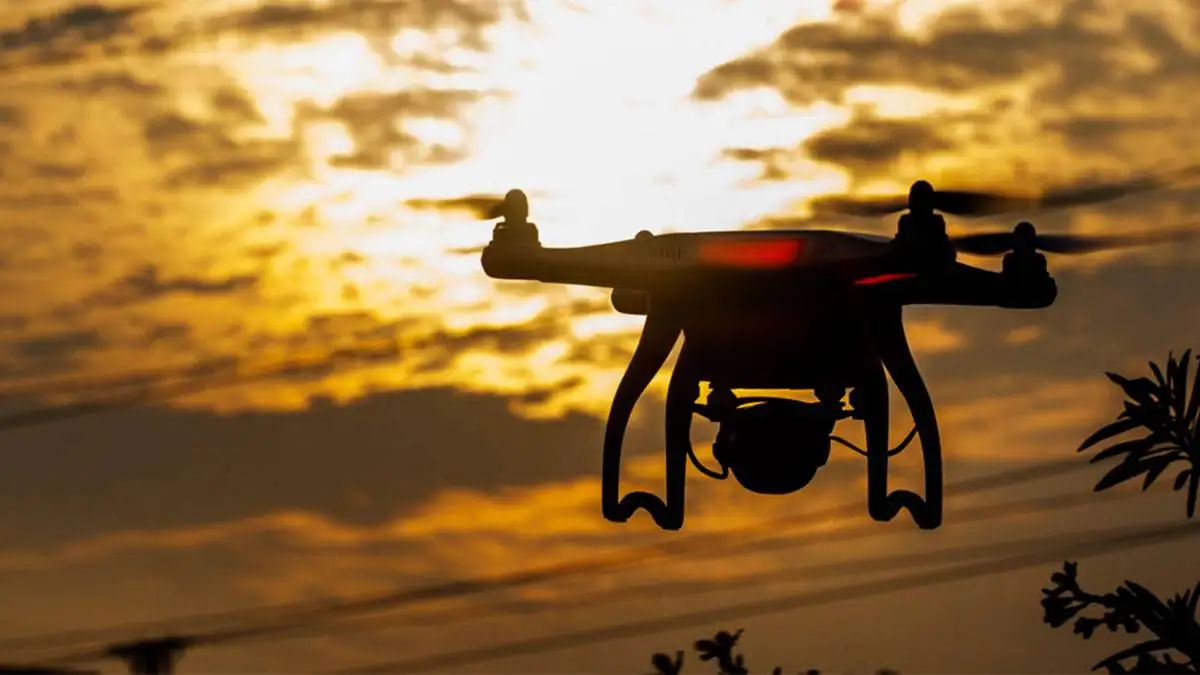 Box-style CCTV camera with optical zoom placed on a clean white background