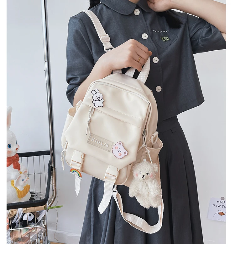 Small pastel backpack for women and girls with dual-use straps, kawaii design, and roomy compartments for school, travel, and casual wear. 04
