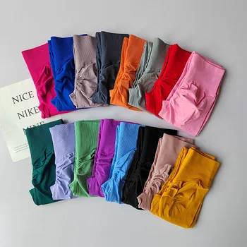 Pantaloni fitness per glutei color pesca che stringe la pancia a vita alta Senza restrizioni Ciclismo Pilates Leggings yoga ad alta elasticità delicati sulla pelle