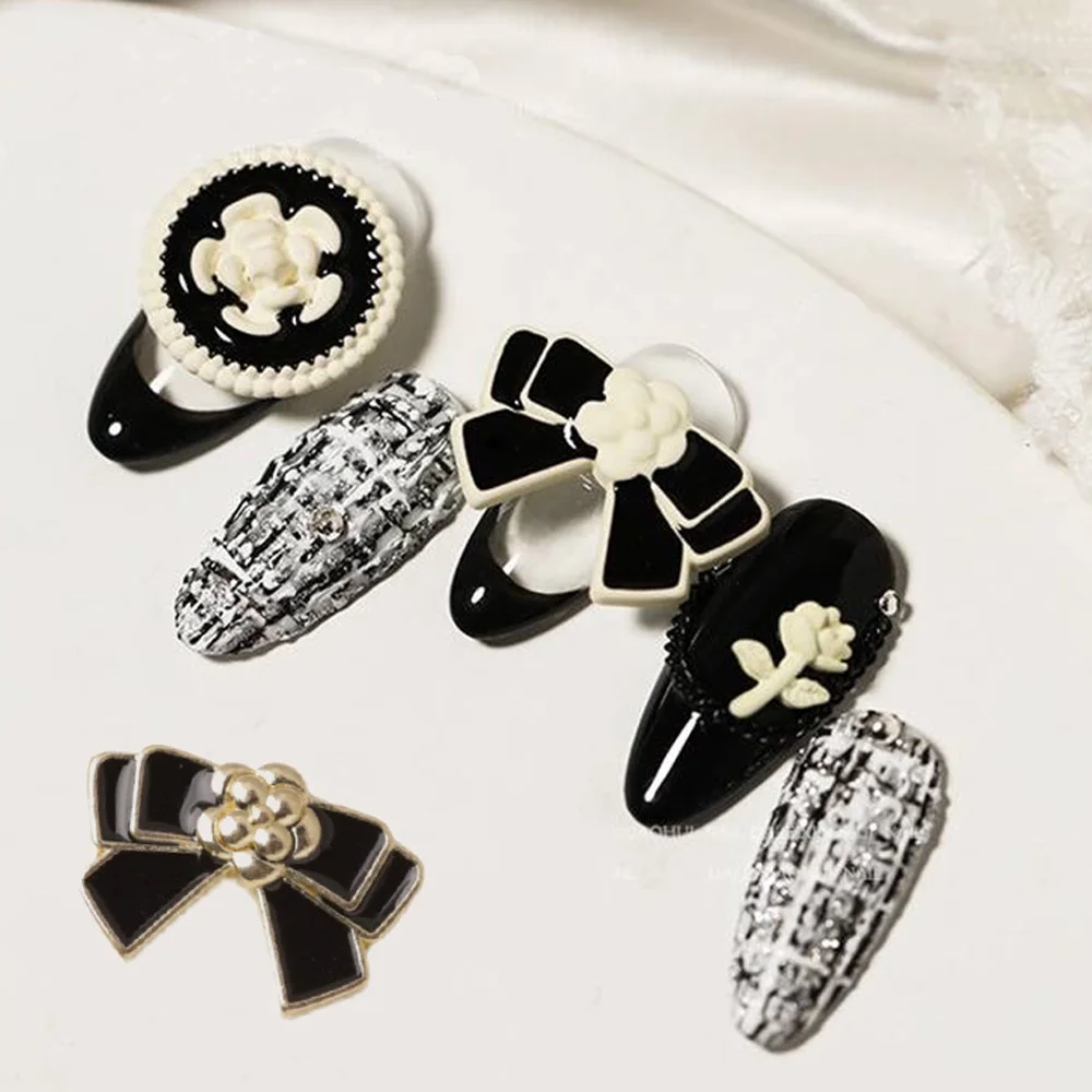 10pcs 블랙 화이트 Bowknot 네일 아트 매력 꽃 네일 라인 석과 3D 프랑스어 고급스러운 금속 합금 활 DIY 네일 액세서리