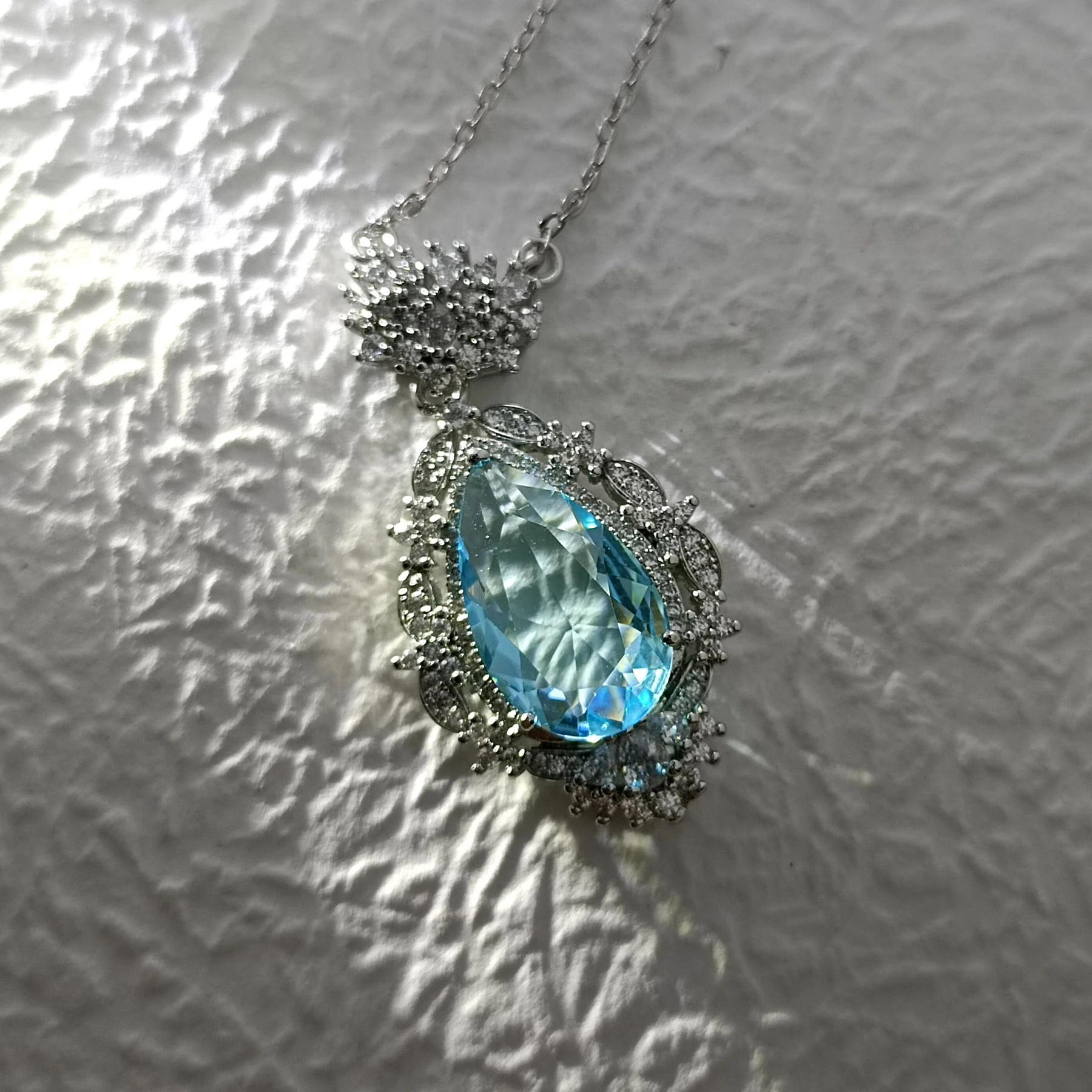 Glamorous Silver Tone Art Deco Ornate Cluster Halo Blue Pear Drop Pendant Necklace Ethereal Jewelry