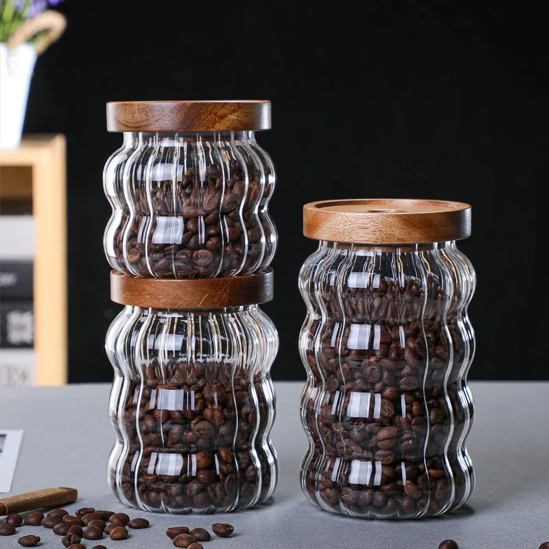 https://ae01.alicdn.com/kf/S2226892f17a140d8a3031371b98adb22S/Transparent-Glass-Storage-Jar-Sealed-Bottle-Coffee-Bean-Candy-Jar-with-Wooden-Lid-Tea-Tank-Glass.jpg