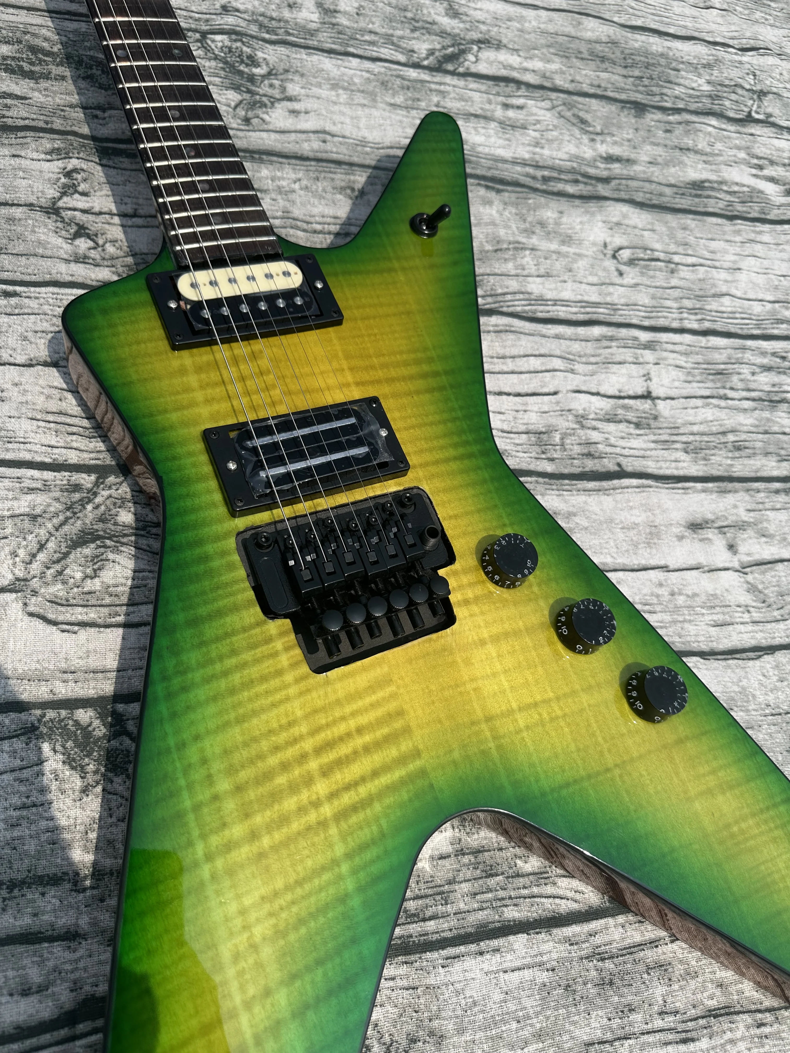 

Irregular electric guitar, black double shake, imported wood and paint, green tiger pattern, bright light, in stock, fast shippi