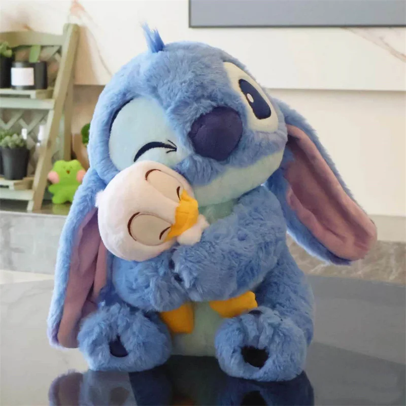 thumbnail image 1 of Peluche de pato Kawaii Stitch, muñeco de peluche de Lilo Stitch con dibujos animados, almohada de peluche suave, decoración del hogar, regalo de vacaciones para niños, 1 of 4