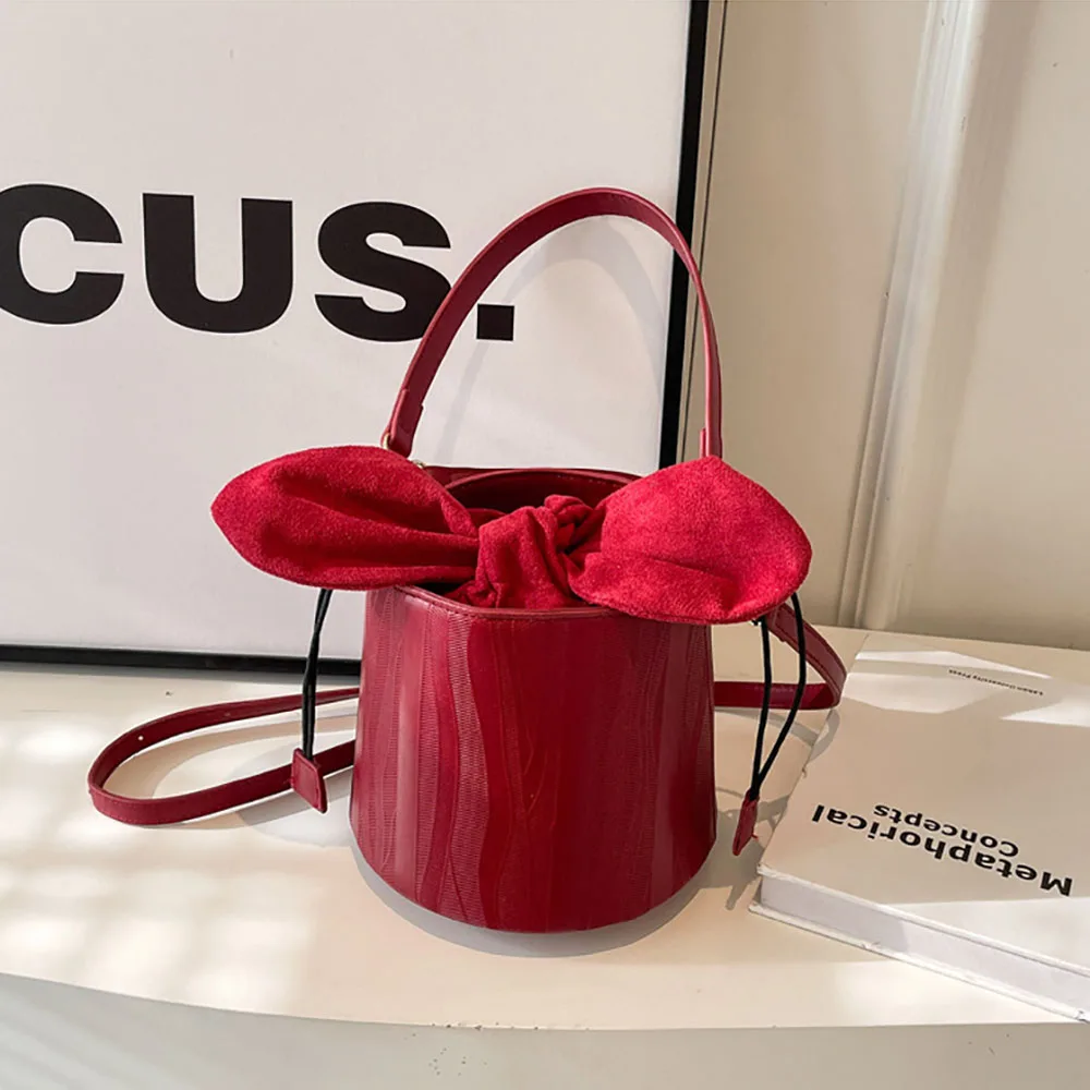 

Темпераментные сумочки-ведра для женщин, новинка 2024, популярные сумки через плечо с бантом на шнурке, элегантная женская сумка для макияжа для вечеринки