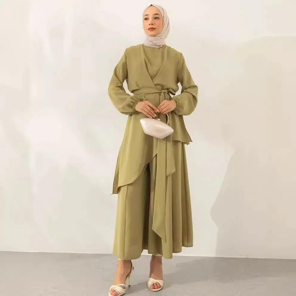 Modest two-piece women's Muslim outfit with a top tie and wide-leg pants suitable for Ramadan in Morocco, Dubai, Islam, casual Arabic clothing collection.