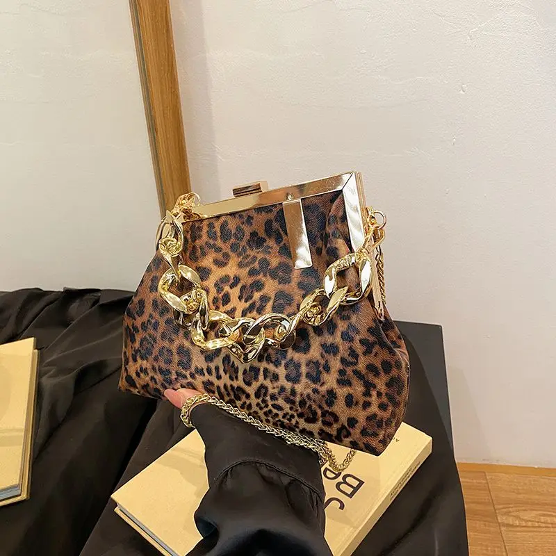 Carauana UNIU Leopard Clutch front view leopard print