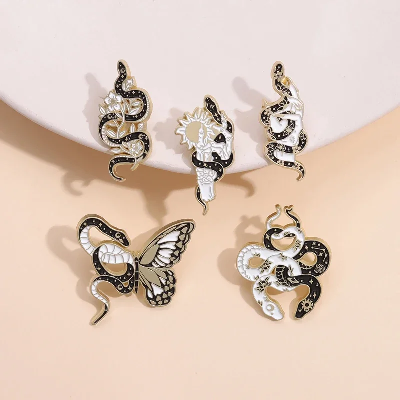 

Funny Butterfly Snake Enamel Pins Black White Sun Moon Snake Winding Brooch Lapel Badges Gothic Animal Jewelry Gift wholesale