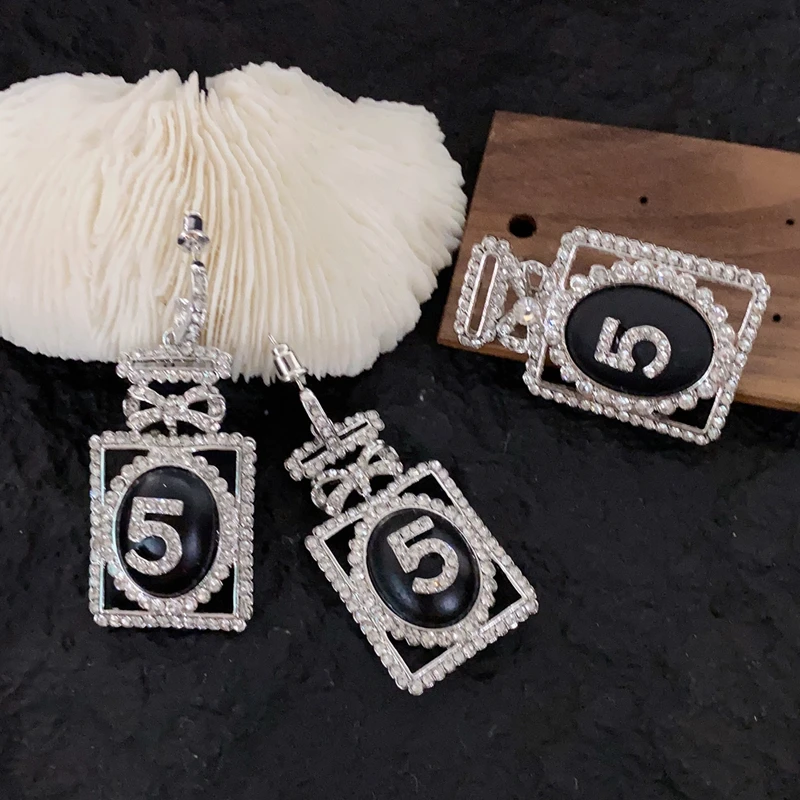 Chanel logo crystal letter dangle drop earrings