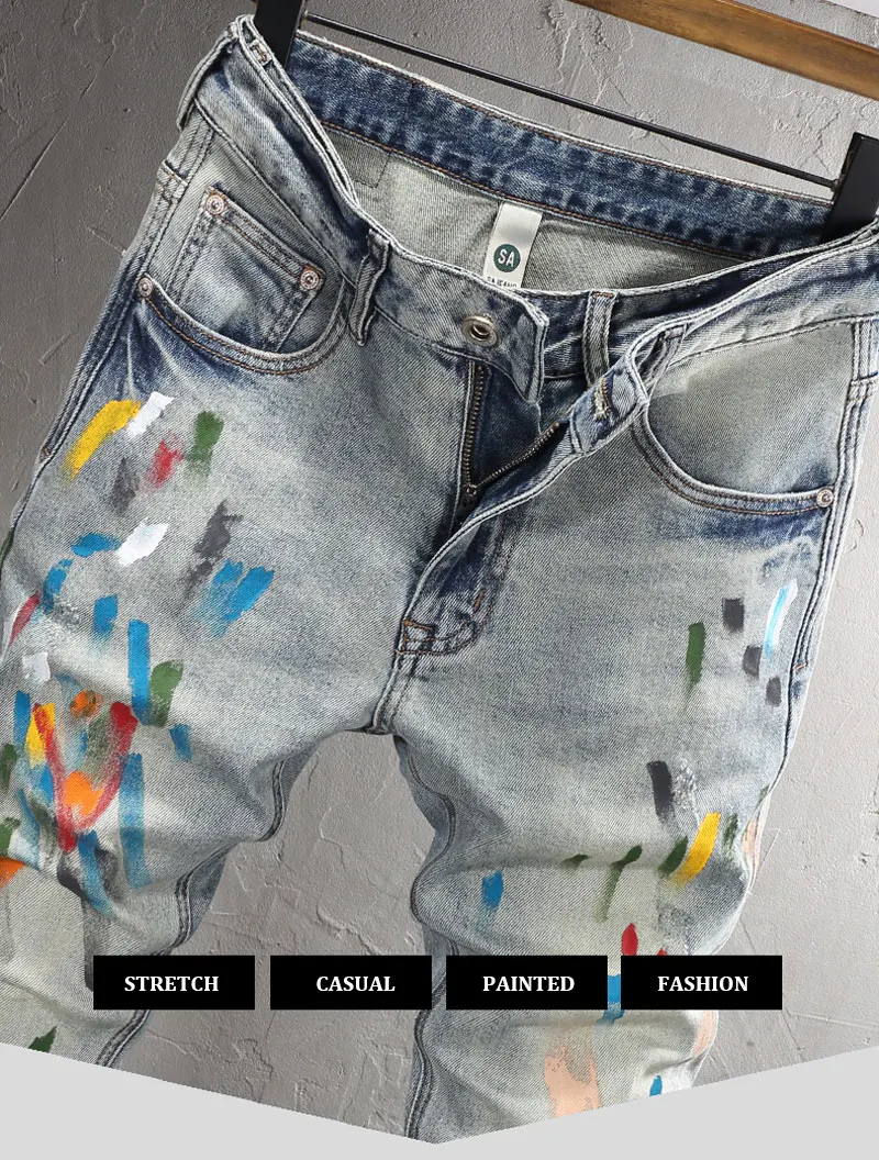 Close- Up front view of light blue Drayven Edgewave Paint Splatter Distressed Jeans on hanger
