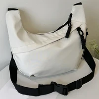Neutral style tote bag with strap for carrying fitness items. New mini street-style handbag with shoulder strap. Lightweight and 2