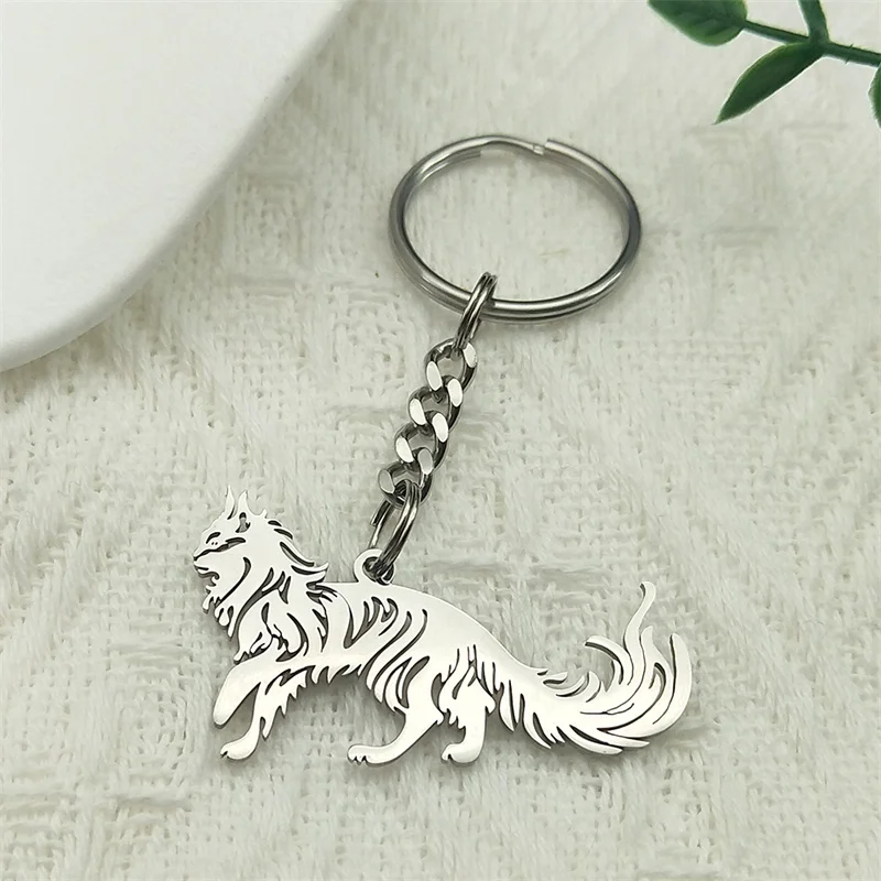 Minimalist stainless steel Maine Coon cat outline keychains in polished silver, gold, and matte black finishes showing explicit size dimensions in centimeters