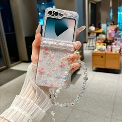 Elegant Floral Wrist Chain Shell Case with Beaded Bracelet - Premium Shockproof Acrylic Cover - Galaxy Z Flip5 (PinkHSL)