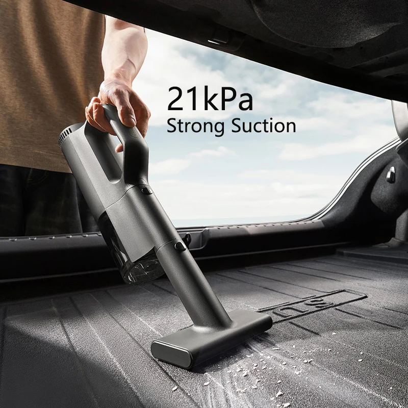 Aspirateur voiture puissant 21kPa Mijia 2400mAh, main tenant la buse près d'un tapis.