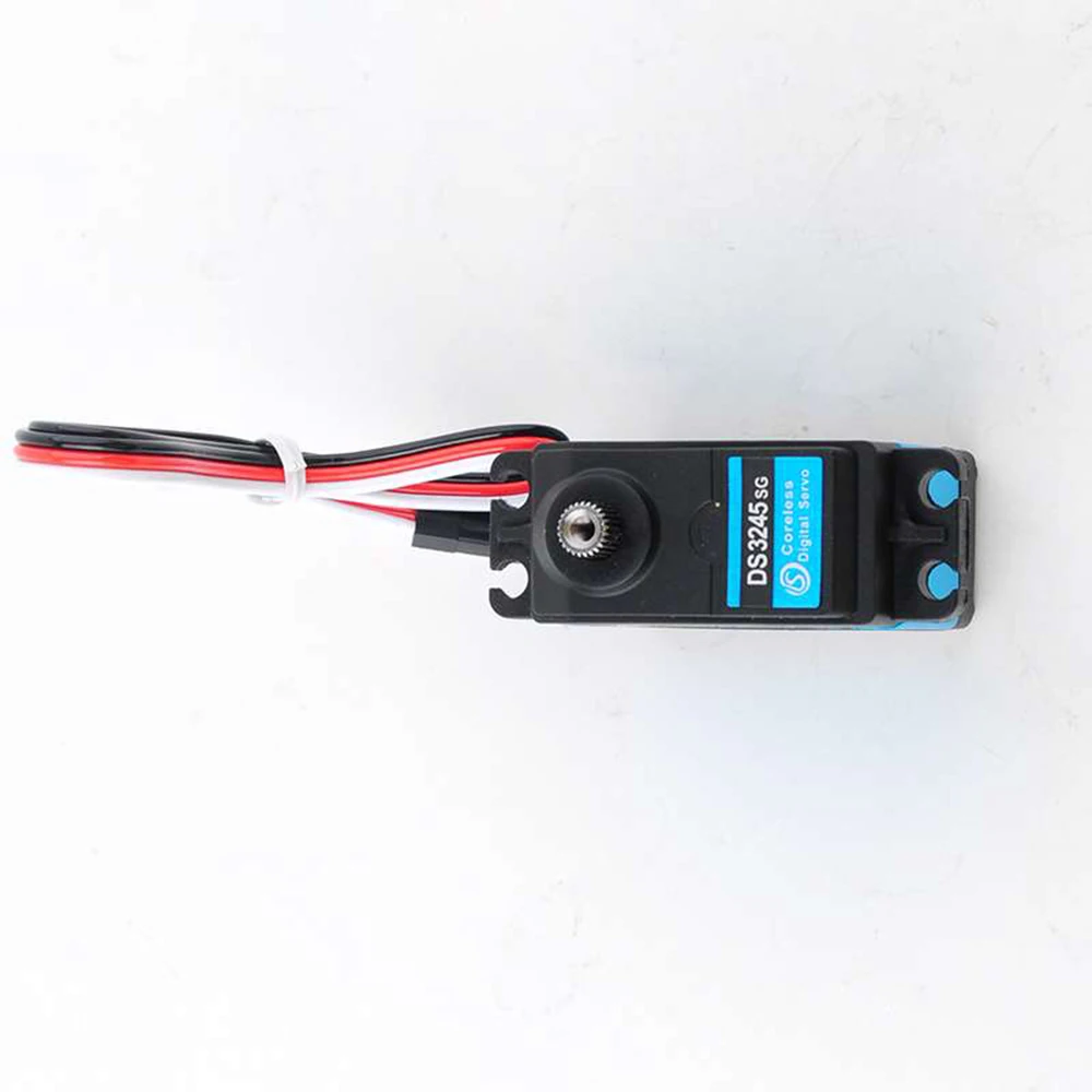 Le Servo Moteur Coreless DS3245 45Kg Haute Vitesse 180/270° IP66 posé sur une surface, avec une règle à côté pour illustrer sa taille.