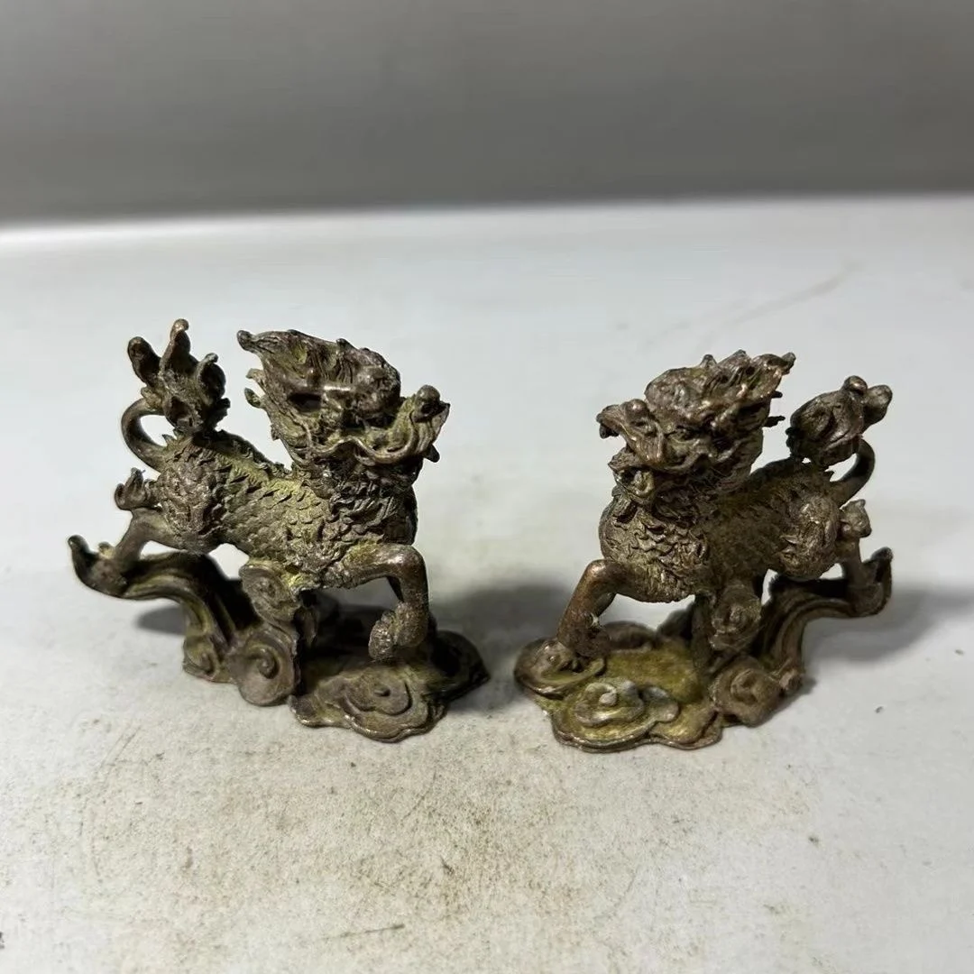 

A pair of small Qilin mythical beasts and small town paper copper coated paste handicraft decorations