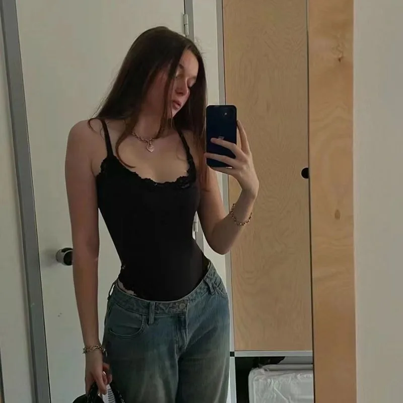 black bodysuit styled with jeans in a mirror selfie