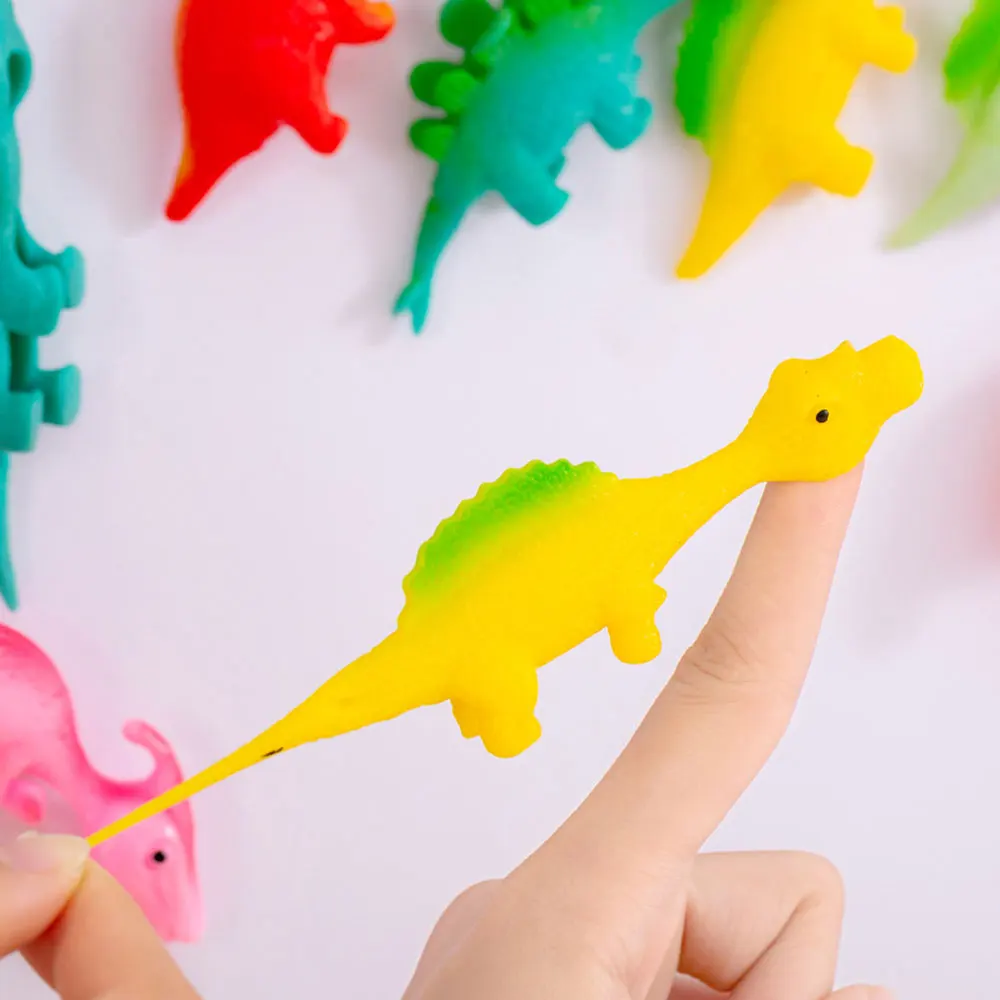 Jouets de doigt de dinosaure créatifs pour enfants, animaux de dessin animé  drôles, anlande soulignée, instituts, tir, jeu de catapulte de fronde -  AliExpress