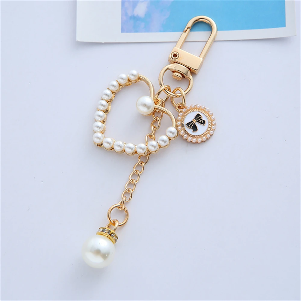 Elegante portachiavi con perle finte, conchiglia a forma di foglia, portachiavi con ciondolo per donna, decorazione quotidiana, ciondolo per borsa, portachiavi per auto, regalo di compleanno  36